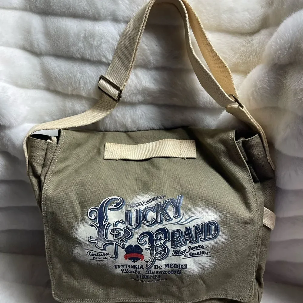 Lucky Brand large canvas olive green messenger bag with adjustable beige strap.